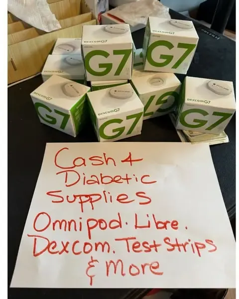 Handwritten "Cash 4 Diabetic Supplies" sign offering cash for test strips — OneTouch is one of the brands that falls under it
